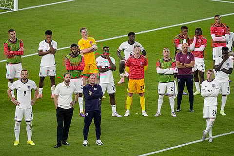 England's players react at the end of the final match
